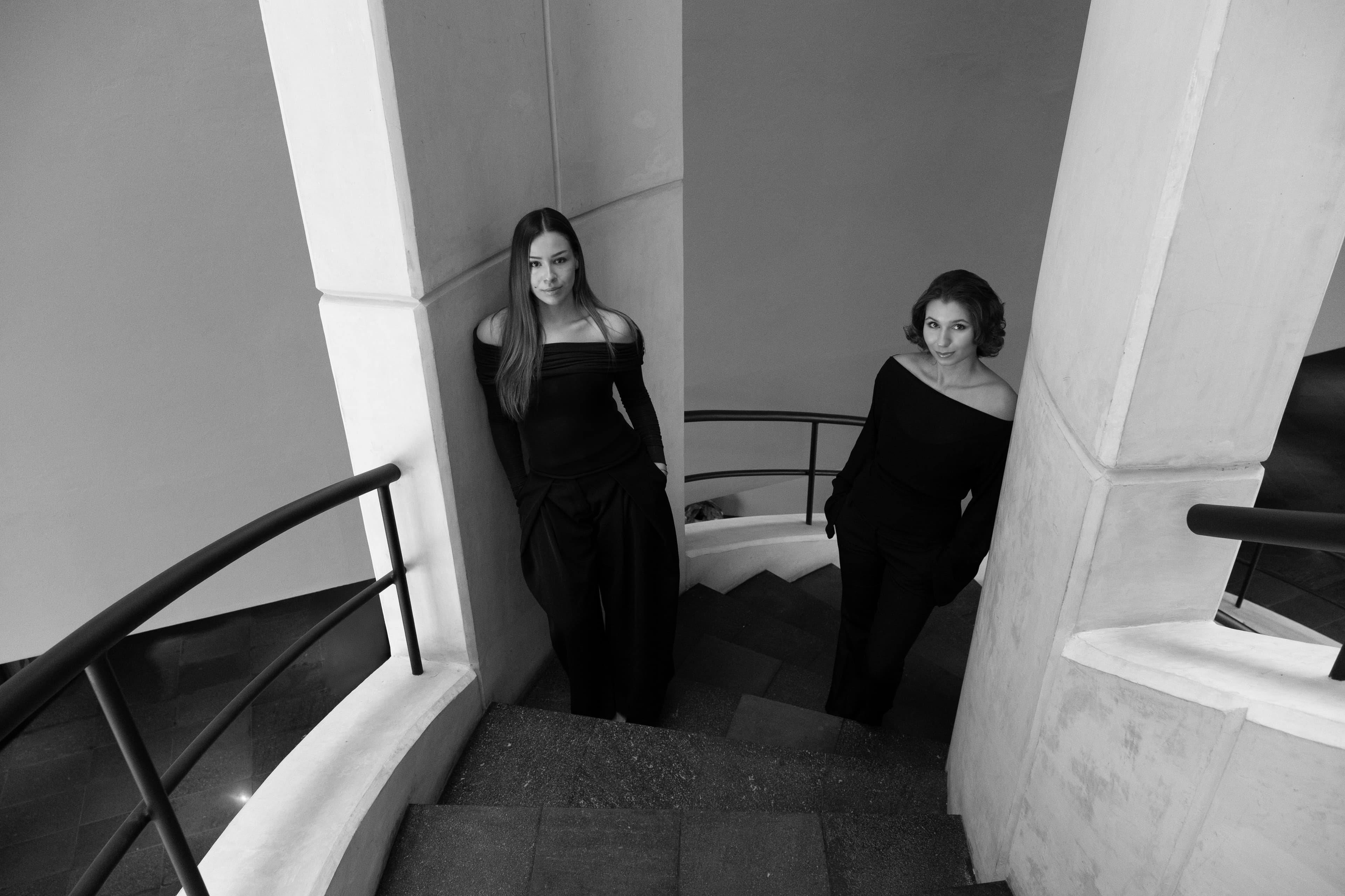 The Den founders on a staircase